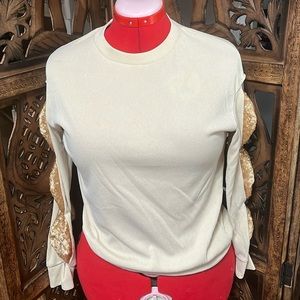 Beautiful tan and gold knit sweater. Gently used.